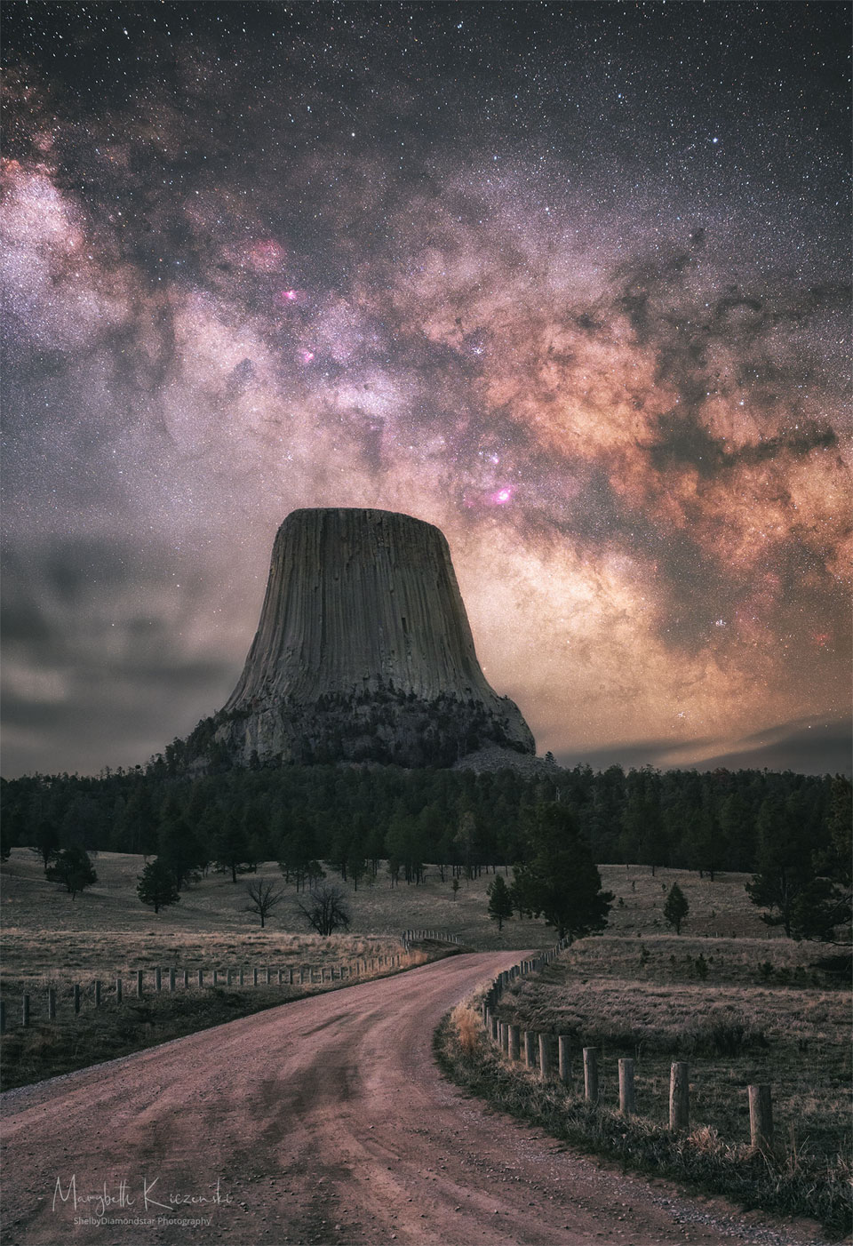The featured image shows Devils Tower in Wyoming, USA
under a brilliant sky that includes a deep image of the 
central bank of our Milky Way galaxy.
Please see the explanation for more detailed information.