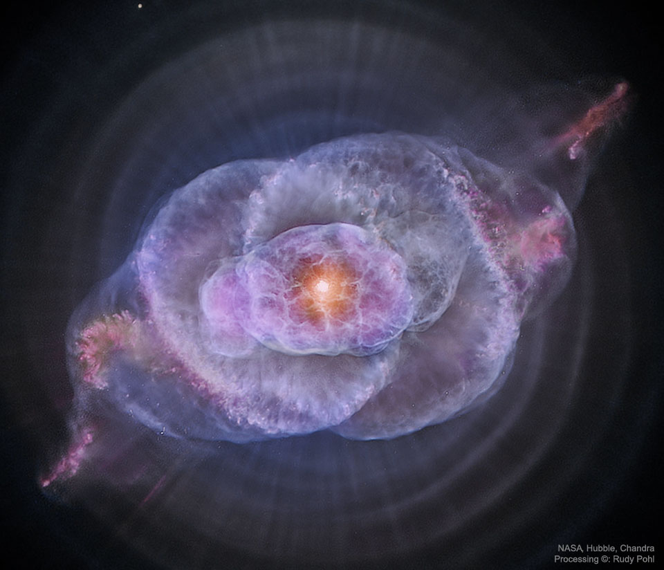 Zdjęcie Mgławicy Kocie Oko ukazuje gazową strukturę o niezwykłym kształcie, świecącą 
na purpurowo, z jasnym, pomarańczowym wnętrzem. 
Więcej szczegółowych informacji w opisie poniżej.